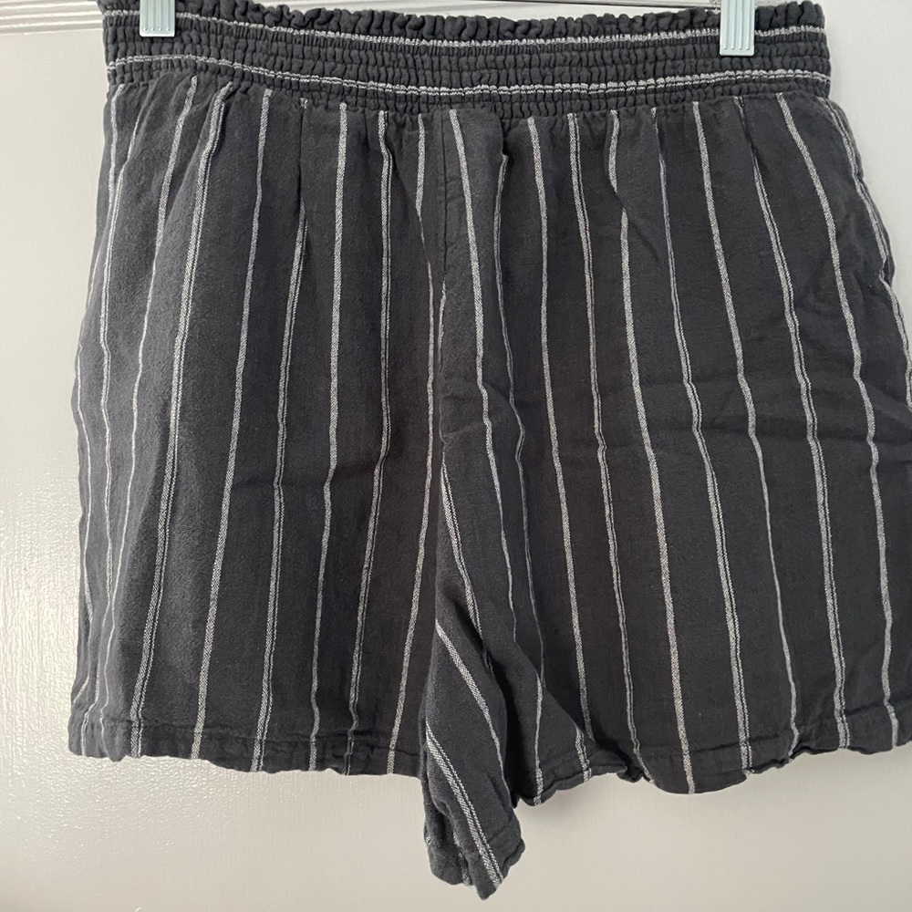 Navy shorts, white strips